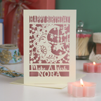 A laser cut birthday card with moon design and the text "Make a wish", personalised with a name
