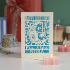 A laser cut birthday card with moon design and the text "Make a wish", personalised with a name