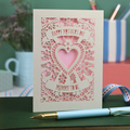 A laser cut Mother's Day card for a Mummy to be, with intricate heart and flower design and text "Happy Mother's Day, Mummy to be"