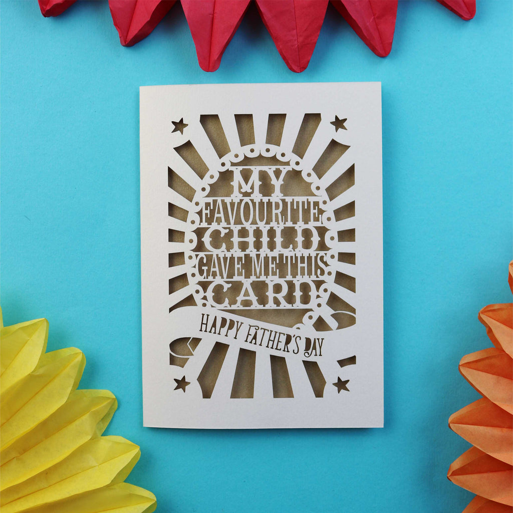 A funny laser cut card that says "My favourite child gave me this card. Happy Father's Day"