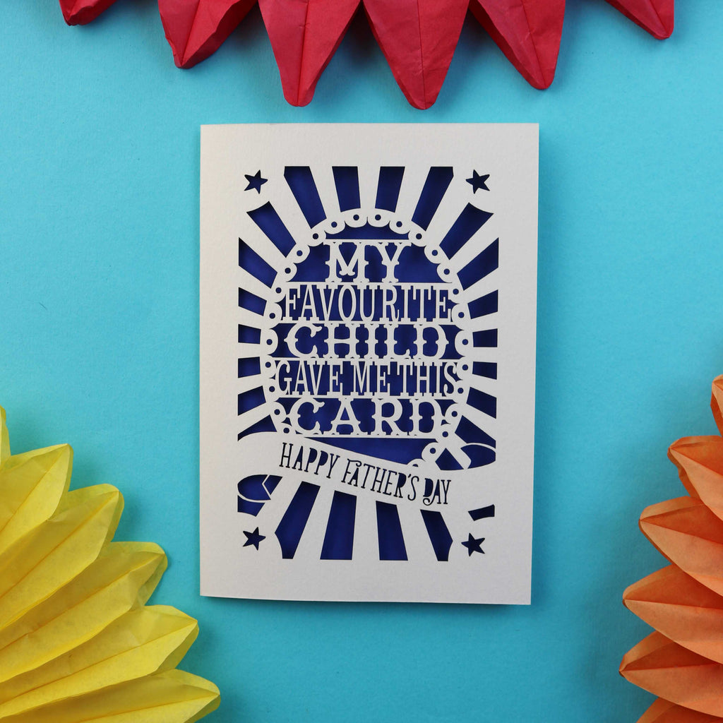 A funny laser cut father's day card that says "My favourite child gave me this card. Happy Father's Day"