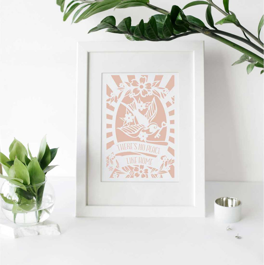 A printed gift with the words "there's no place like home"