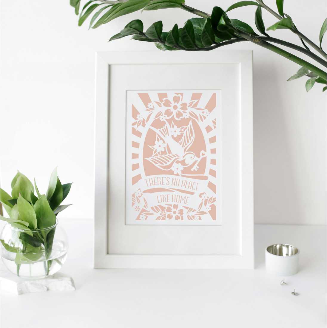 A printed gift with the words "there's no place like home"