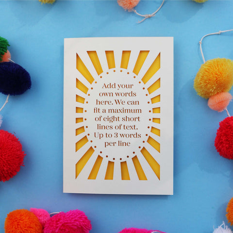 A personalised laser cut card with your own text surrounded by a laser cut border.