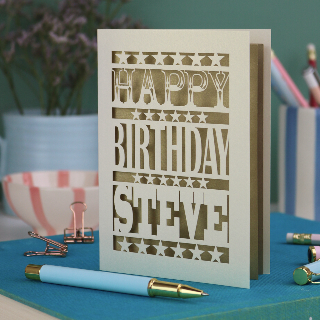 A laser cut personalised birthday card that says "Happy Birthday Steve" in bold text with star design.
