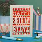 A laser cut personalised birthday card that says "Happy Birthday Steve" in bold text with star design.
