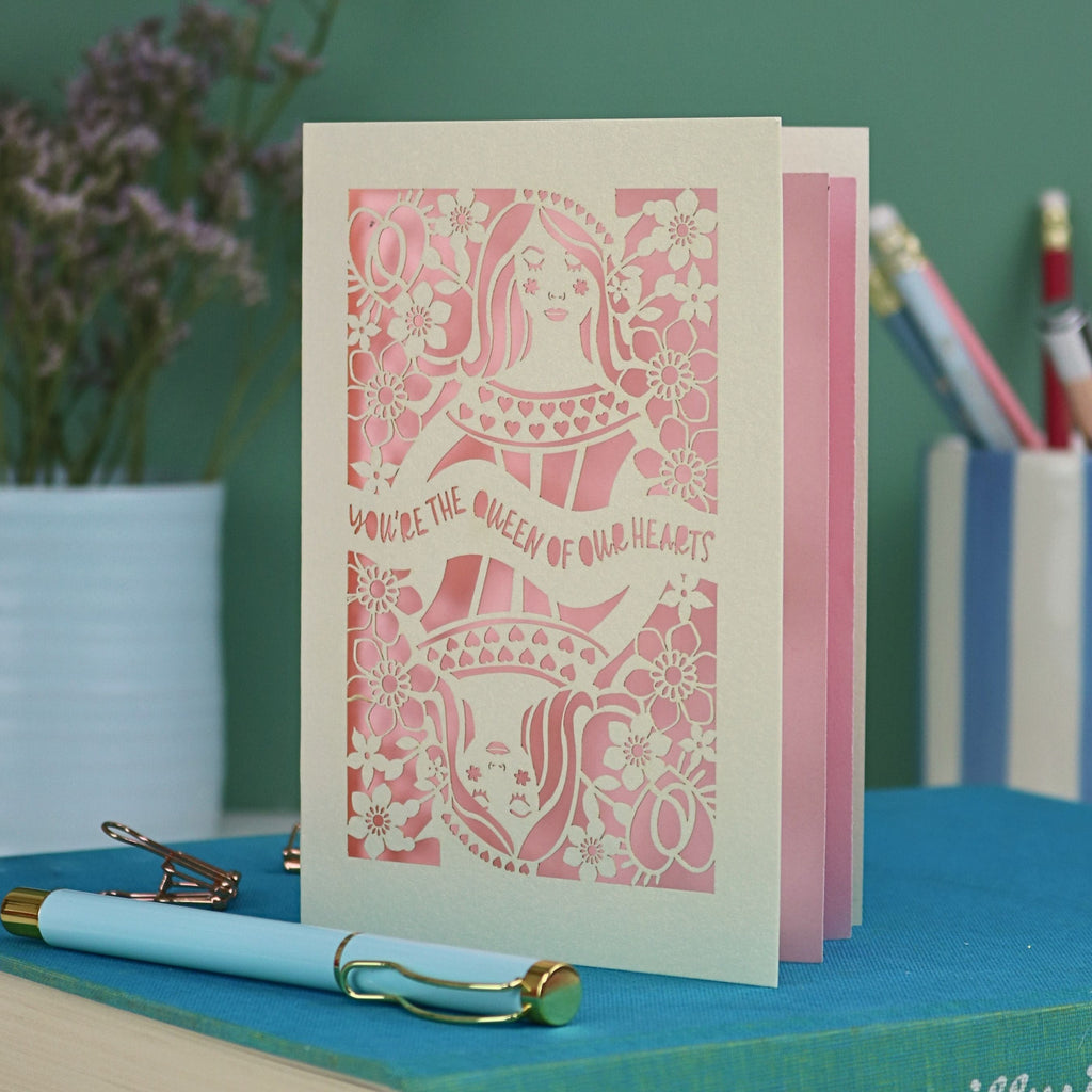 A laser cut Queen of Hearts Mother's Day card with the text "You're the Queen of Our Hearts"