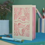 A laser cut Queen of Hearts Mother's Day card with the text "You're the Queen of Our Hearts"