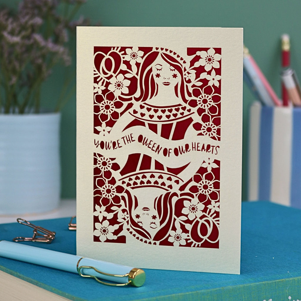 A laser cut Queen of Hearts Mother's Day card with the text "You're the Queen of Our Hearts"
