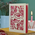 A laser cut Queen of Hearts Mother's Day card with the text "You're the Queen of Our Hearts"