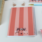 The reverse of the notebook with striped design and Pogofandango logo