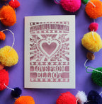 A papercut Valentines card that says "Happy Valentine's Day, Love from" and is personalised with a name