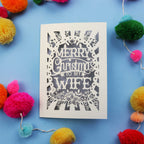 Wife Christmas card with 'Merry Christmas to my Wife' text on a blue background with colourful pom-poms.