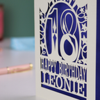 A laser cut 18th birthday card, personalised with a name, and the text "18, Happy Birthday"