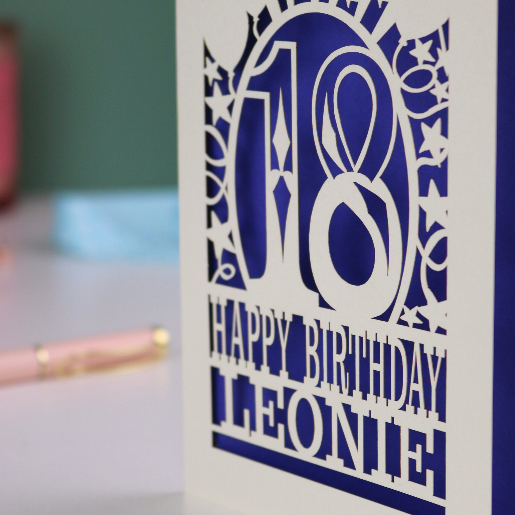 A laser cut 18th birthday card, personalised with a name, and the text "18, Happy Birthday"