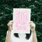 A candy pink print with a hot air balloon and the words "adventure awaits"