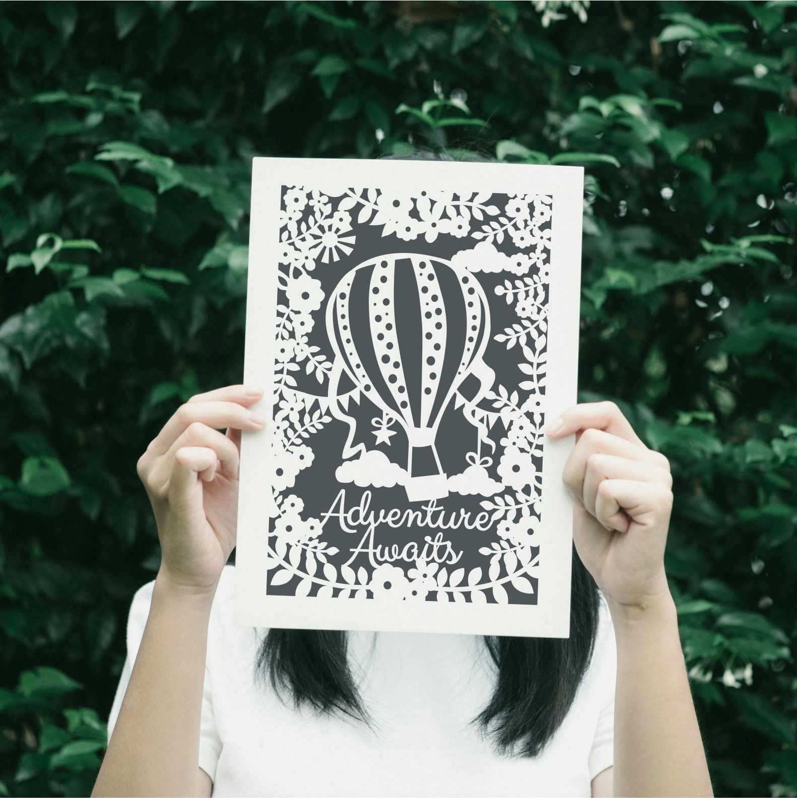 A charcoal print for kitchens with the words "adventure awaits"