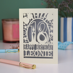 A laser cut 18th birthday card, personalised with a name, and the text "18, Happy Birthday"