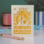 A laser cut 18th birthday card, personalised with a name, and the text "18, Happy Birthday"
