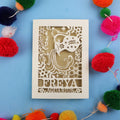 Decorative Aquarius Birthday card with 'FREYA AQUARIUS' design on a blue background with colourful pom-poms.