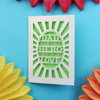 A laser cut father's day card that says "Dad, A son's first hero, a daughter's first love"
