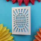 A papercut father's day card that says "Dad, A son's first hero, a daughter's first love"