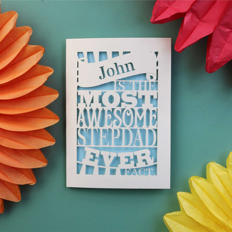 A personalised laser cut card that says "NAME is the most awesome stepdad ever. Fact." - A5 / Light Blue