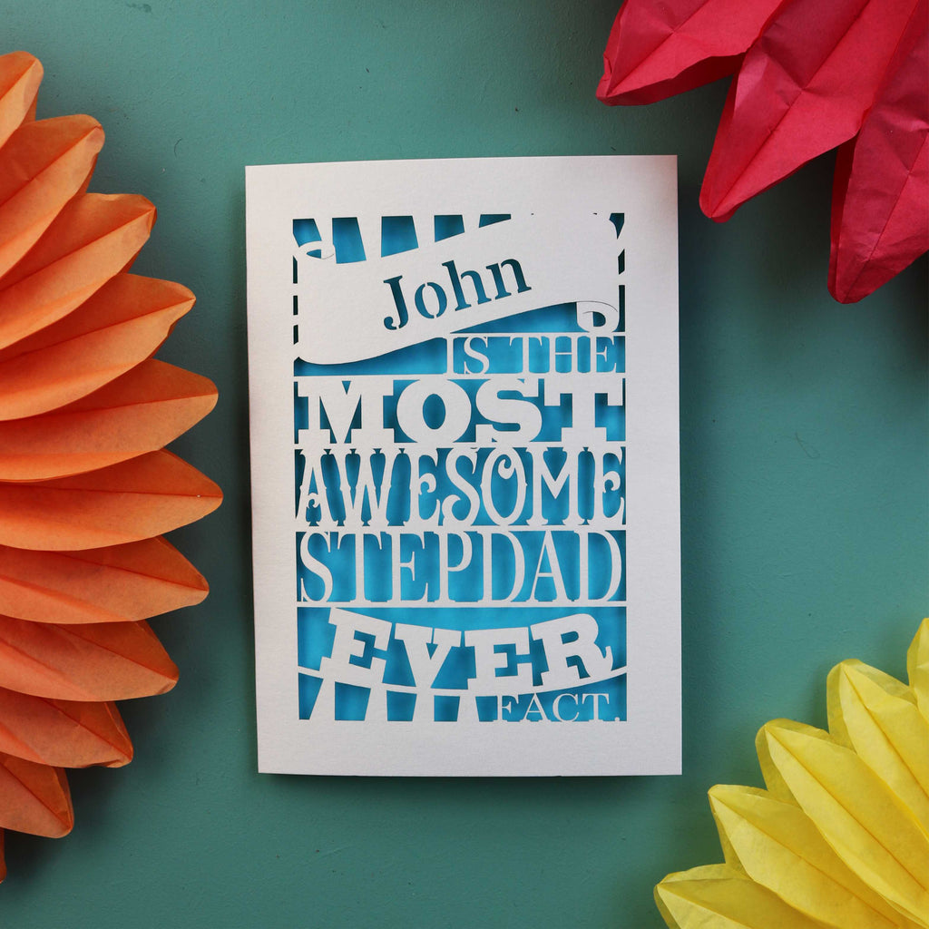 A laser cut step dad fathers day card that says "name is the most awesome stepdad ever, fact.