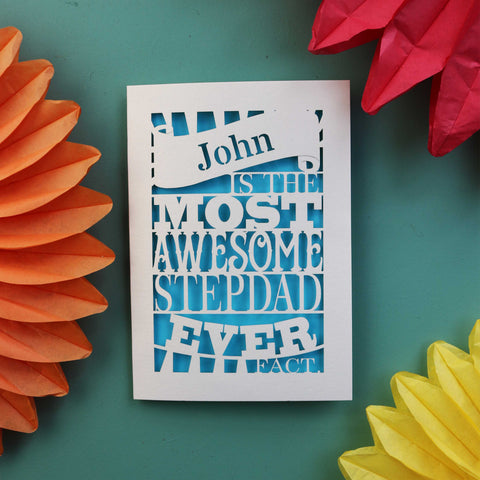 A laser cut step dad fathers day card that says "name is the most awesome stepdad ever, fact. - A5 / Peacock Blue