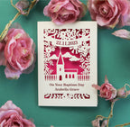 Laser cut Baptism card, personalised with date and a name. Design shows a church surrounded by flowers 