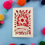 Laser Cut Bar Mitzvah card with Star of David design on a blue background with colourful pom-poms.