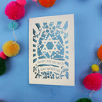 BatMitzvah card with Star of David design on a blue background with colourful pom-poms.