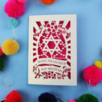 Cut out Bat Mitzvah card with Star of David design on a blue background with colourful pom-poms.