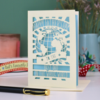 A laser cut Father's Day card with globe design and the text "Happy Father's Day to the Best Dad In the Whole world"
