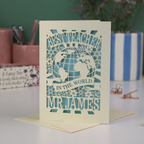 A laser cut cream thank you teacher card with globe design and the text Best Teacher in the World Mr James"