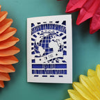 A keepsake Father's Day card from the UK, with a cut out of the world and the words "Happy Fathers Day to the best dad in the whole world"