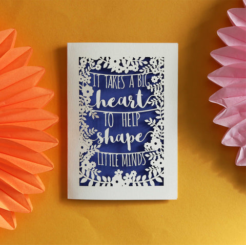 A laser cut thank you teacher card that says "It takes a big heart to help shape little minds."