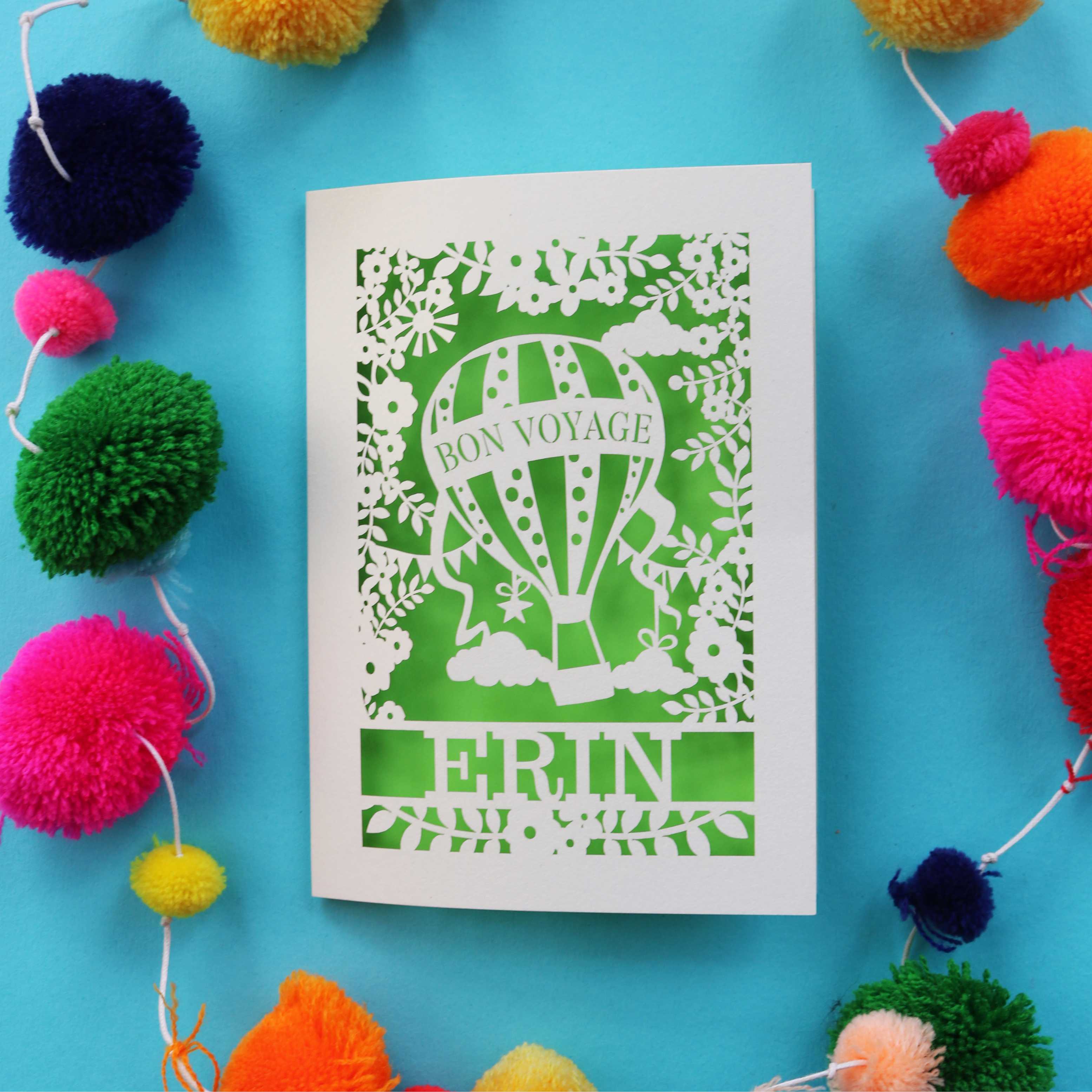 A cream and bright green laser cut bon voyage card