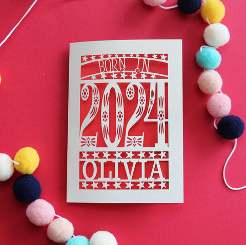 A personalised laser cut New baby card that says "Born in 2024"
