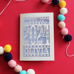 A personalised paper cut birthday card that says "Born in 2024"