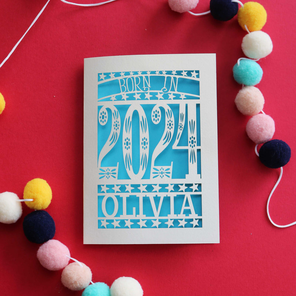A personalised laser cut card that says "Born in 2024"