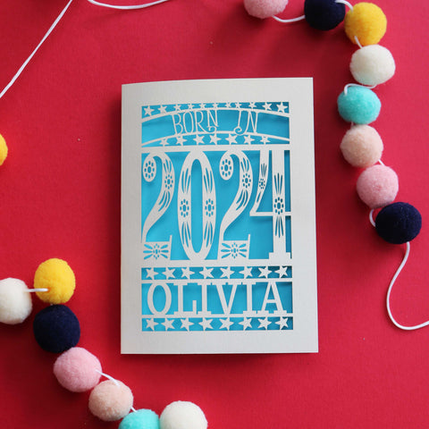 A personalised laser cut card that says "Born in 2024" - A6 (small) / Peacock Blue