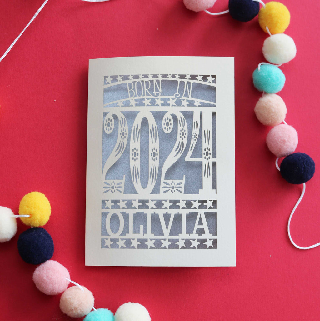 A personalised laser cut New baby card that says "Born in 2024"