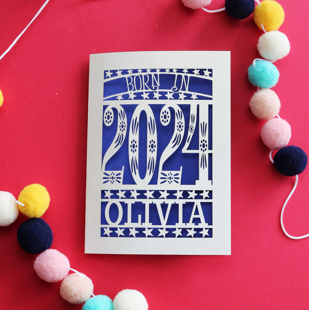 A laser cut New baby card that says "Born in 2024"