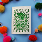 Papercut Boyfriend Christmas card with 'Merry Christmas to my boyfriend' text on a blue background with colourful pom-poms.
