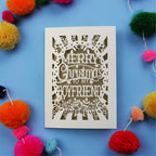 Unique Boyfriend Christmas card with 'Merry Christmas to my boyfriend' text on a blue background with colourful pom-poms.