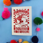 Laser cut boyfriend Valentines Card with 'Happy Valentine's Day to the best boyfriend in the world' text on a blue background with colourful pom-poms.