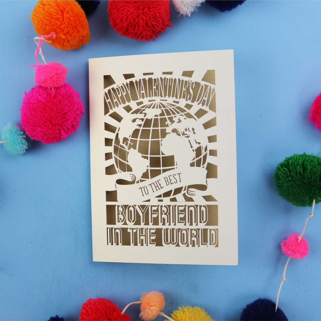 Cute boyfriend Valentines Card with 'Happy Valentine's Day to the best boyfriend in the world' text on a blue background with colourful pom-poms.