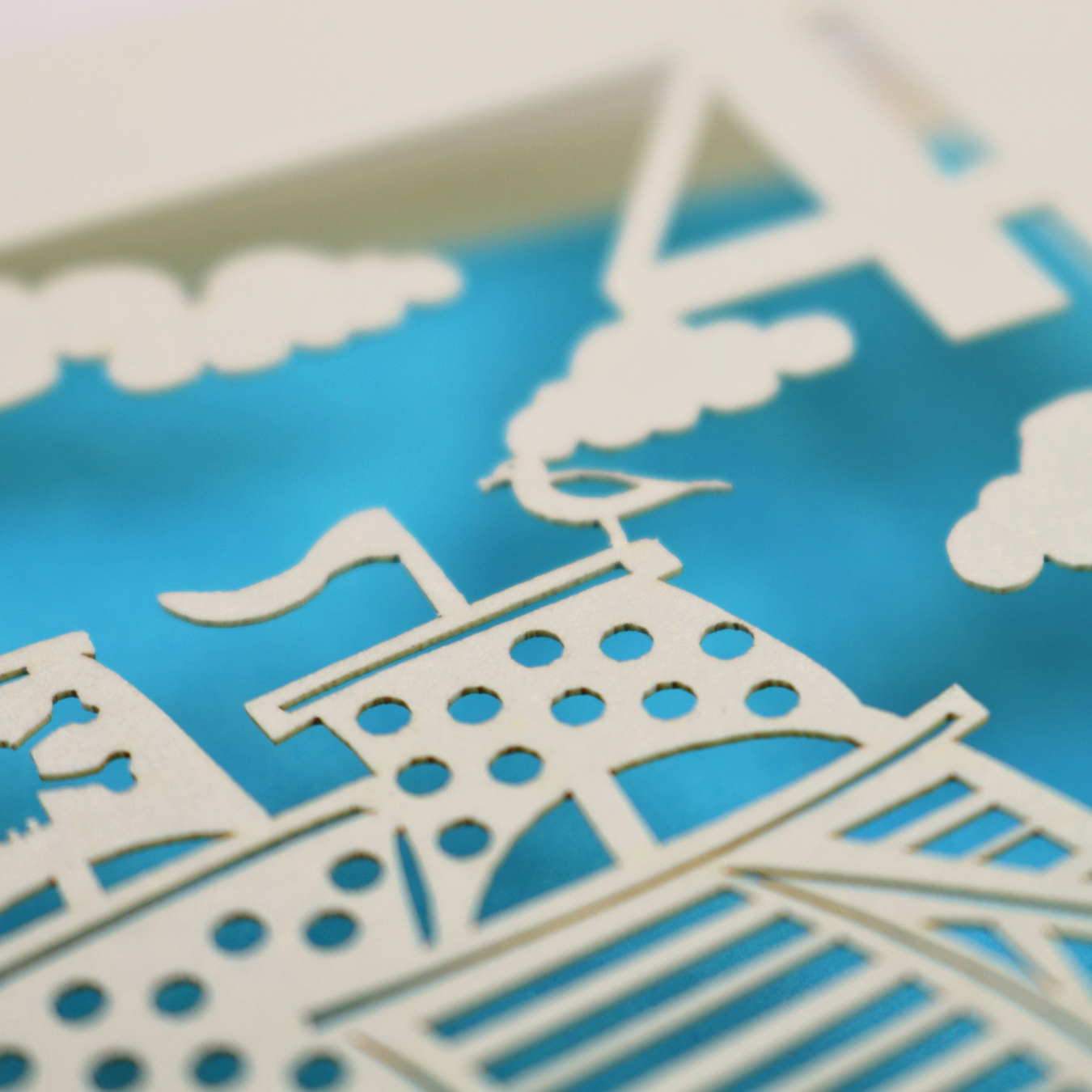 A close up photograph of the spotty sails on the pirate ship with tiny seagull laser cut detail