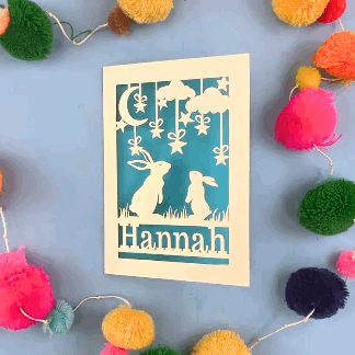 A laser cut bunny birthday card opening and closing